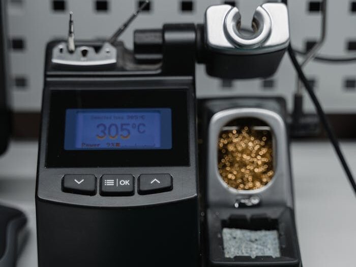 A digital soldering station with temperature display ready for precision electronic repair.